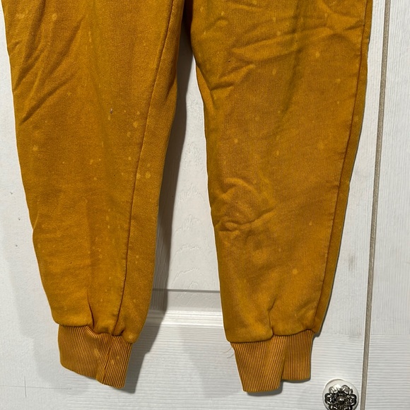 Mustard Urban Outfitters Puffy Pants with light bleach spots. - Picture 4 of 9